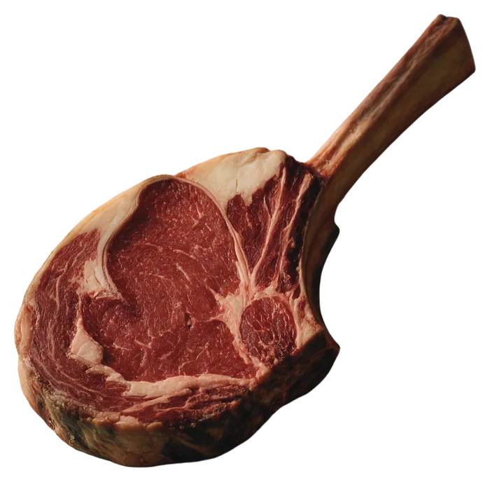A thick dry-aged tomahawk steak with a long rib bone.